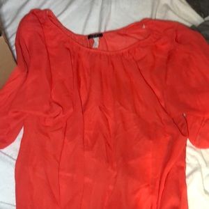 Sheer blouse looks good with any tank underneath